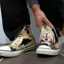 tearing rotting bleached Chucks
